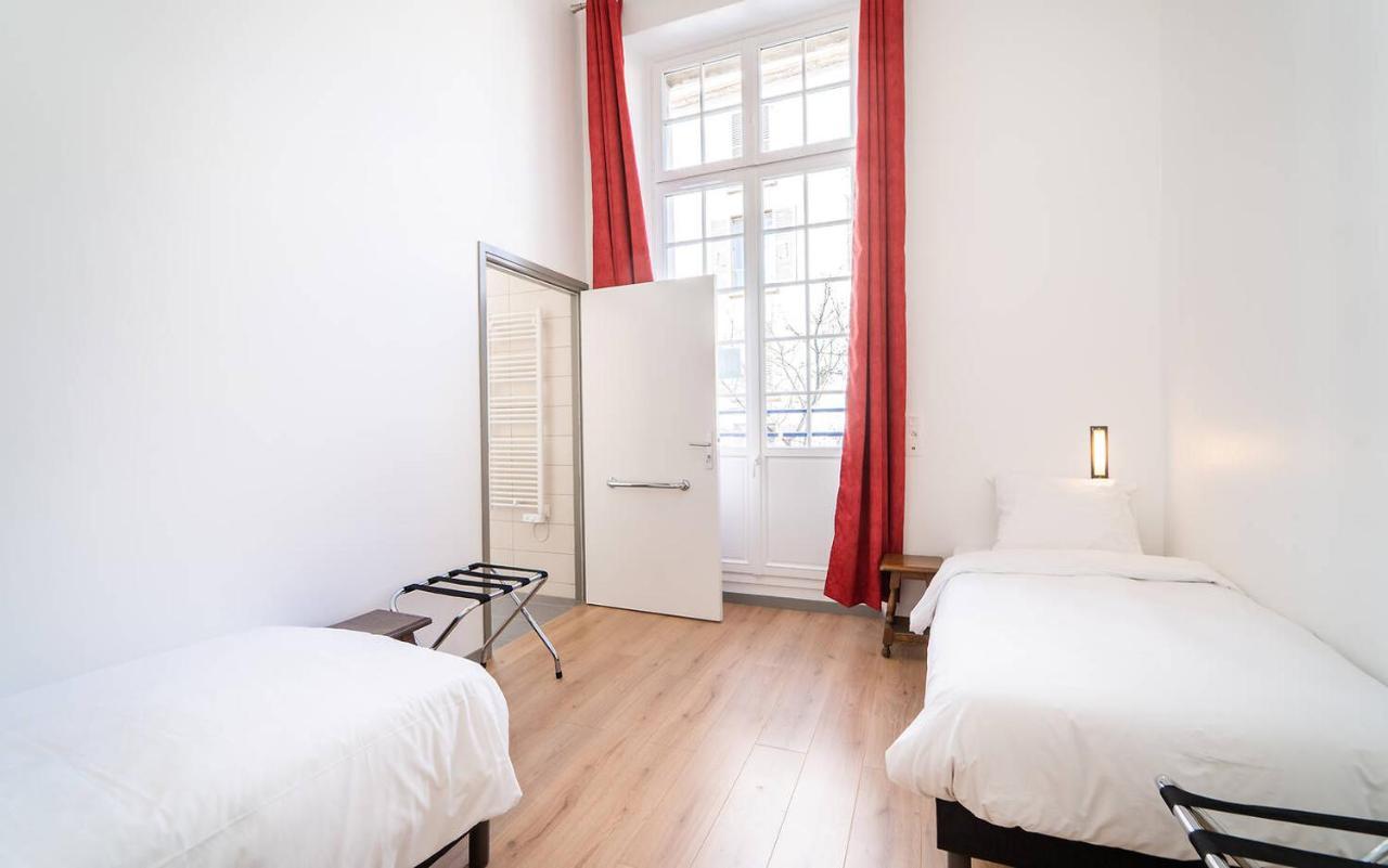 Mije Marais Hostel Paris Exterior foto A typical room at the hostel